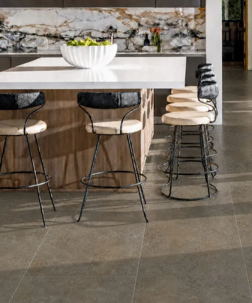 Sunlit Stone - 19/64" (7.5mm) - Swiss Techslate (MSunSt7.5) Modern kitchen featuring durable Sunlit Stone Swiss Techslate flooring with a warm taupe stone pattern.