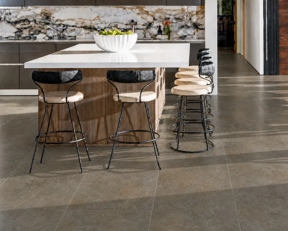 Sunlit Stone - 19/64" (7.5mm) - Swiss Techslate (MSunSt7.5) Modern kitchen featuring durable Sunlit Stone Swiss Techslate flooring with a warm taupe stone pattern.