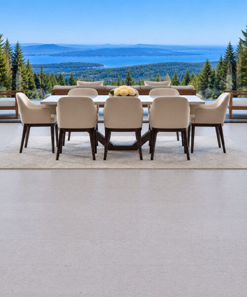 Sustainazzo - 25/64" (10mm) - Cork Floating (FSus10) Sustainazzo light gray floating cork flooring frames a mountain lake-view dining room with upholstered seating.