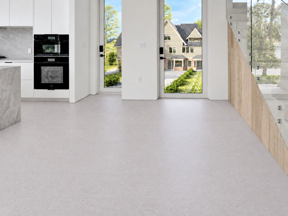 Sustainazzo - 25/64" (10mm) - Cork Floating (FSus10) Sustainazzo pale white cork flooring creates a seamless entryway beside modern cabinetry and a glass staircase.