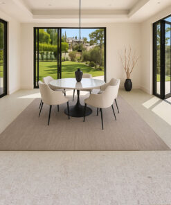 Light gray Swiss cork floating flooring in modern dining room with round table, soft chairs, and large glass doors