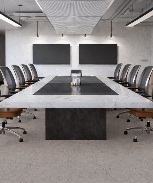 Modular - 7/16" (11mm) - Swiss Real Cork Floating (FMod11) Modern boardroom with long table and chairs on light gray cork flooring, commercial office interior de