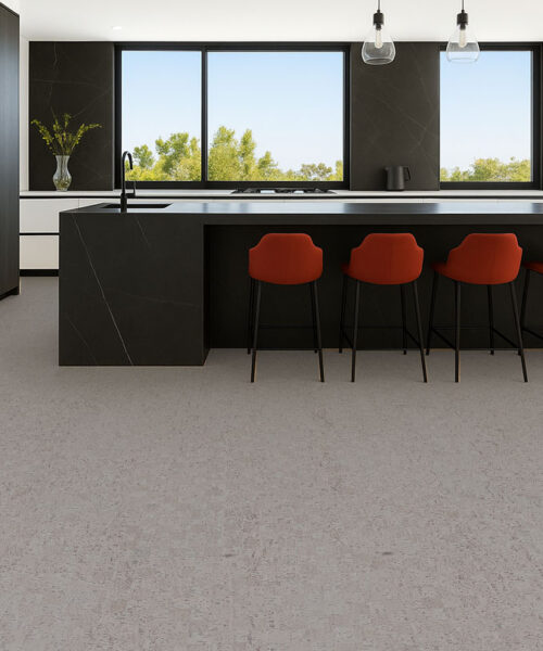 Modular - 7/16" (11mm) - Swiss Real Cork Floating (FMod11) Contemporary kitchen with black island and red bar stools on light gray cork flooring, sleek modern style