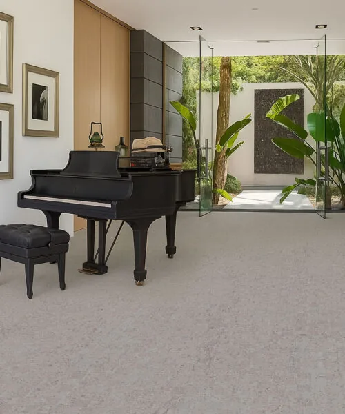 Elegant piano room with grand piano on light gray cork flooring, indoor-outdoor modern living space