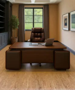 Umber - 1/4" (6mm) - Swiss Cork Glue Down Tile (GUmb6) Modern executive office featuring warm beige cork flooring, a large dark wood desk with leather accents, and a high-back leather chair centered in front of a window. Built-in charcoal cabinetry with shelving lines the left wall, complemented by framed geometric artwork on the right. The natural cork floor adds warmth and acoustic comfort to the elegant workspace.