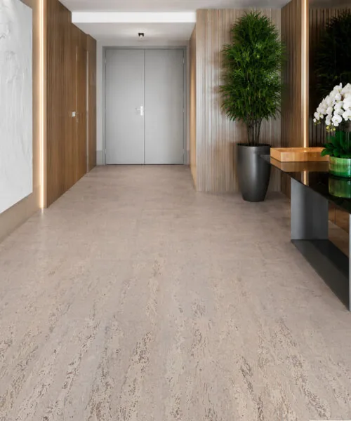 Bright contemporary entrance featuring Umber Grey Swiss Real Cork Floating Flooring with a soft natural cork texture and elegant modern design.