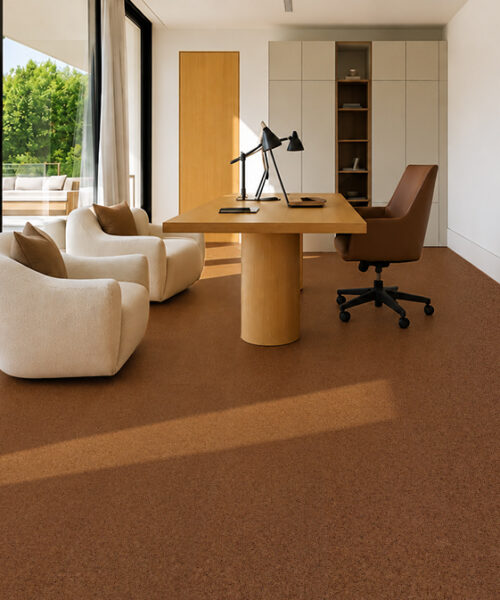 Warm reddish-brown Venetian 10mm cork floor planks extend through a window-lined office with cream chairs.