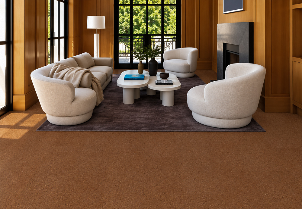 Venetian - 25/64" (10mm) - Cork Floating (FVen10) Venetian 10mm natural cork flooring in warm reddish-brown complements rounded ivory seating and wood-paneled walls.