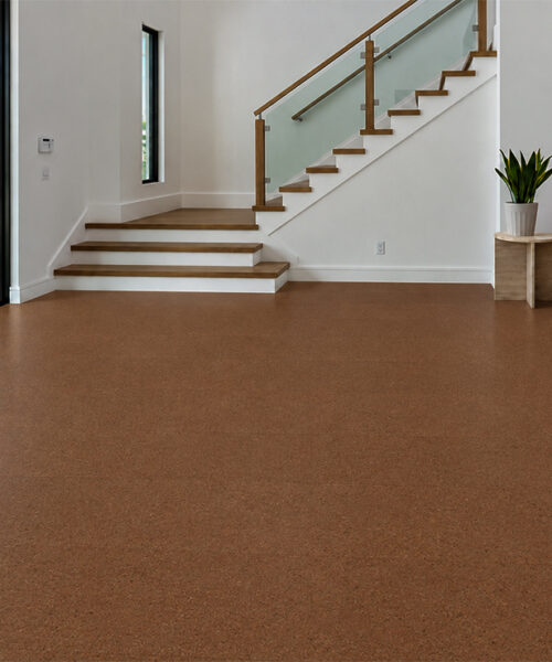 Venetian - 25/64" (10mm) - Cork Floating (FVen10) Fine-speckled Venetian 10mm floating cork flooring covers a bright entryway with glass stairs and built-in bench.