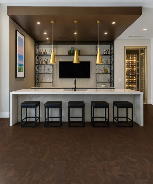 Stylish and resilient Walnut Burlwood cork floor enhancing a high-end bar and entertainment room design.