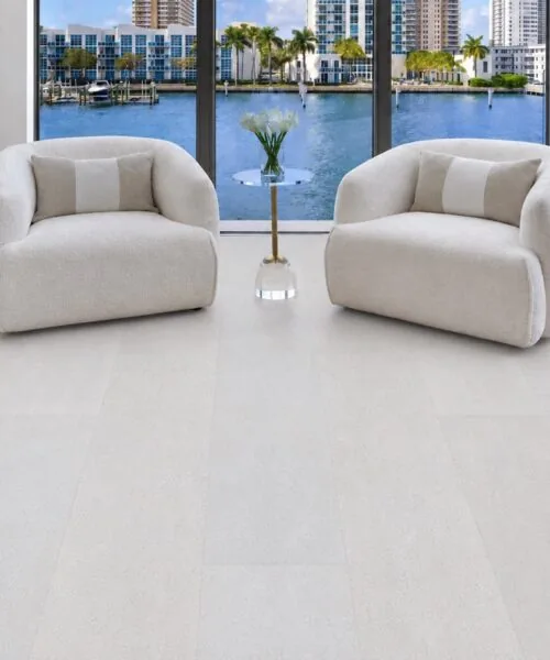 White Leather - 1/2" (12mm) - Cork Floating (FWL12) Bright contemporary living room showcasing White Leather cork flooring with a clean leather-inspired texture and elegant minimalist furnishings.