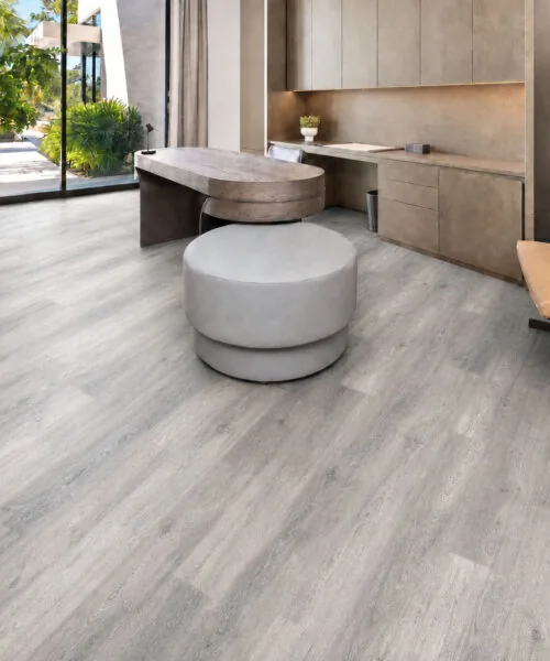 Wild Oak - 13/32" (10.5mm) - Design Cork Floating (FWO10.5) Bright luxury office with light-gray wood-look cork flooring and floor-to-ceiling windows.