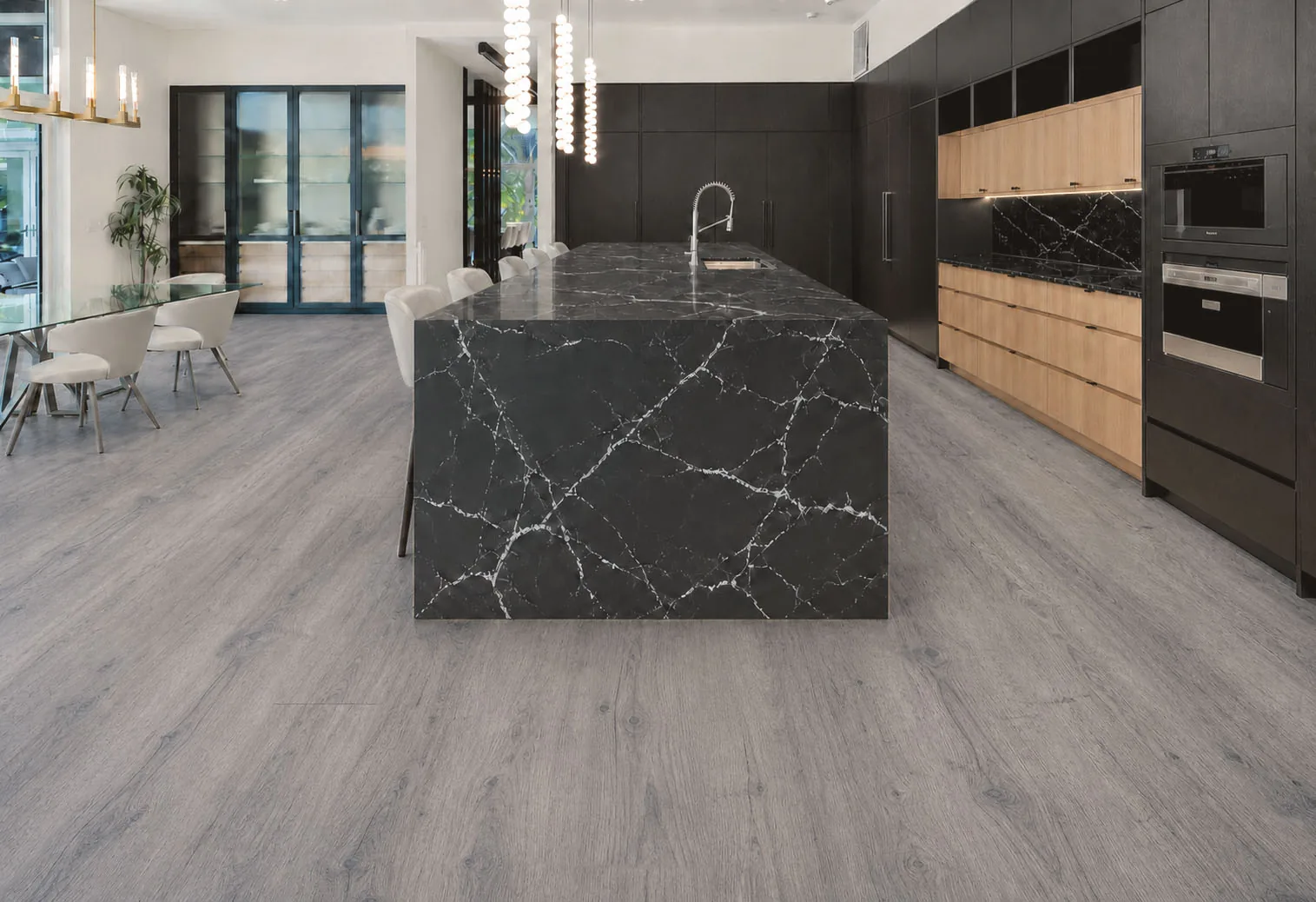 Wild Oak - 13/32" (10.5mm) - Design Cork Floating (FWO10.5) Modern black-and-wood kitchen with wide gray oak-pattern cork floor planks.