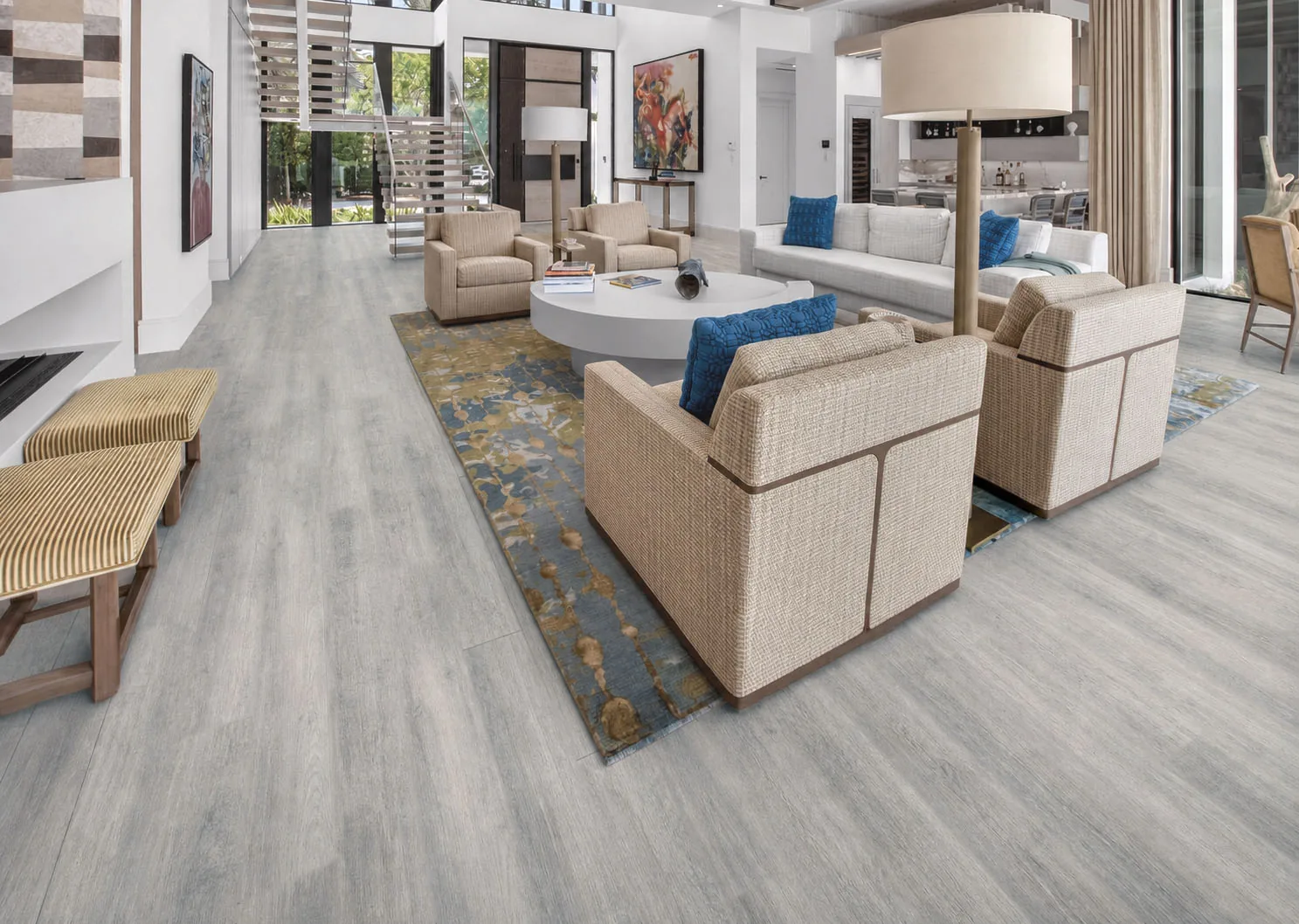 Wild Oak - 13/32" (10.5mm) - Design Cork Floating (FWO10.5) Airy open-plan living space with light-gray oak-look cork floors and modern staircase.