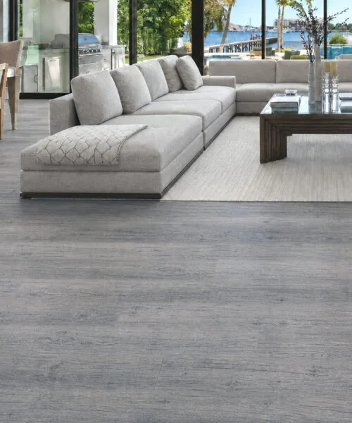 Wild Oak - 13/32" (10.5mm) - Design Cork Floating (FWO10.5) Spacious coastal living room featuring wide-plank gray oak-look cork flooring.