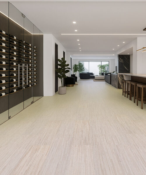 Contemporary wine cellar with glass walls and Vertical Swiss cork flooring, offering a seamless transition to the open living area with elegant marble finishes.