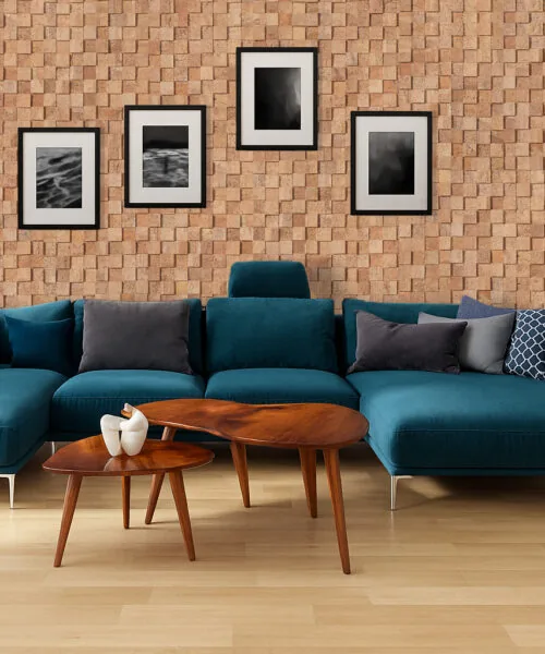 Wood Cubes - 25/64" (10mm) - Cork Wall Tiles (WWoCu10) Modern living room with wood cubes cork wall tiles creating 3D texture, noise-reducing performance, and natural cork warmth behind a teal sofa.